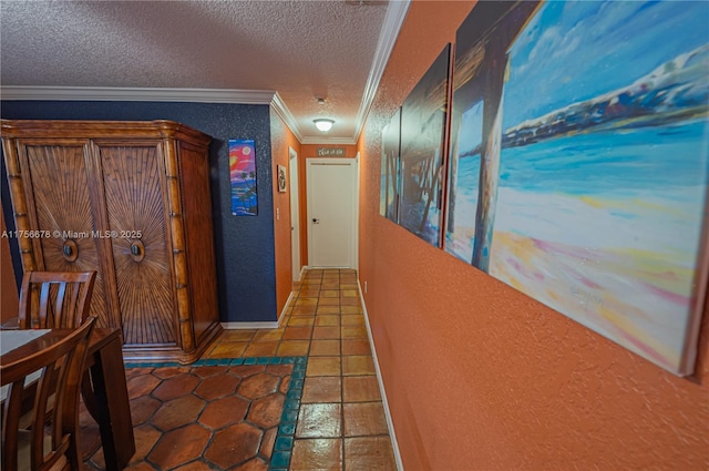 hallway with ornamental molding, a textured wall, and a textured ceiling