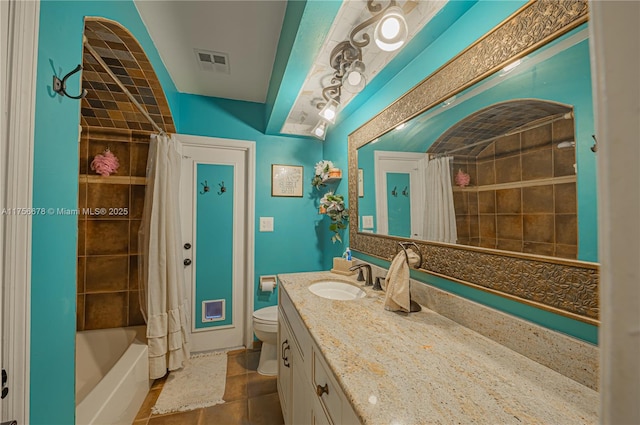 full bathroom featuring visible vents, vanity, toilet, and shower / bath combo with shower curtain