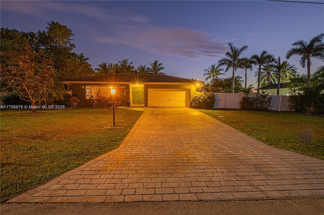 11400 Tara Dr, Plantation, FL 33325 - ranch-style home featuring an attached garage, decorative driveway, and stucco siding