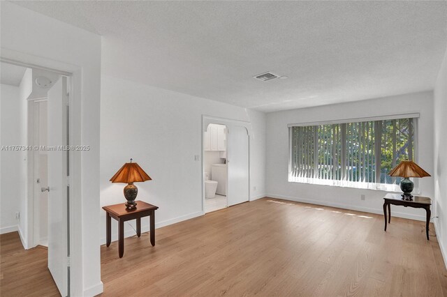 5400 N Ocean Blvd Unit 38, Lauderdale By The Sea, FL 33308 - empty room with light wood-style flooring and baseboards