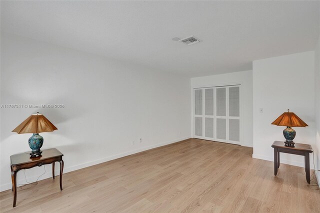 5400 N Ocean Blvd Unit 38, Lauderdale By The Sea, FL 33308 - hall with an upstairs landing, a textured ceiling, and wood finished floors