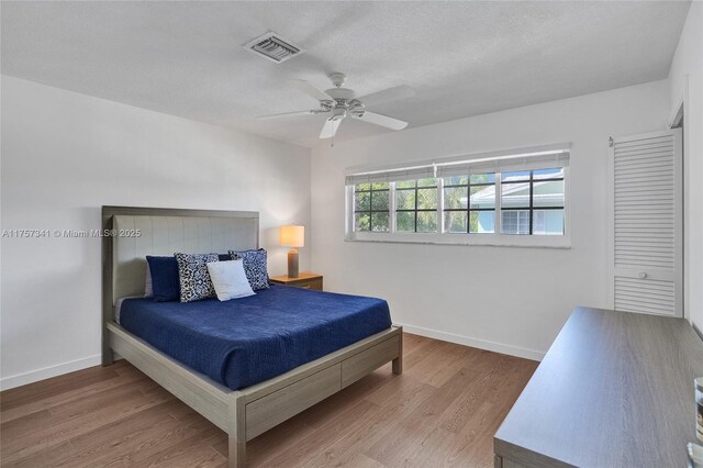 5400 N Ocean Blvd Unit 38, Lauderdale By The Sea, FL 33308 - hallway featuring wood finished floors, a textured ceiling, and baseboards