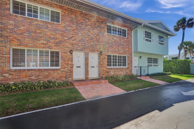 view of front of property featuring brick siding