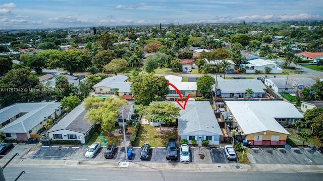 birds eye view of property with a residential view