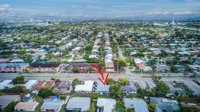 birds eye view of property with a residential view