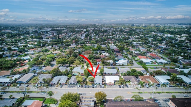 birds eye view of property with a residential view