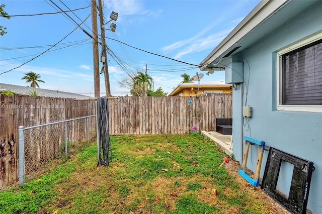 view of yard with a fenced backyard