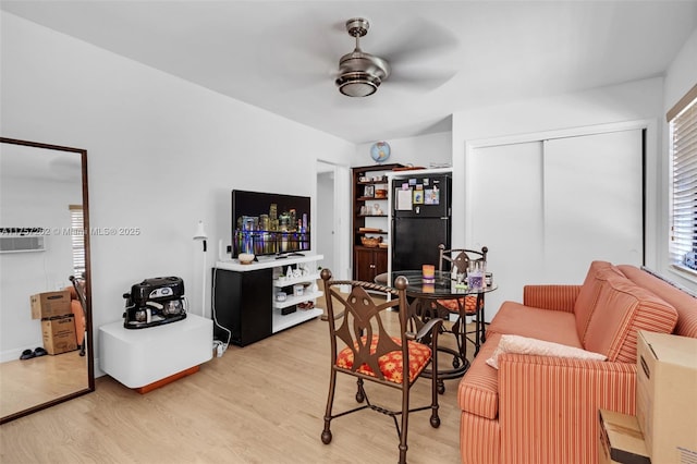 interior space with ceiling fan and light wood-style floors