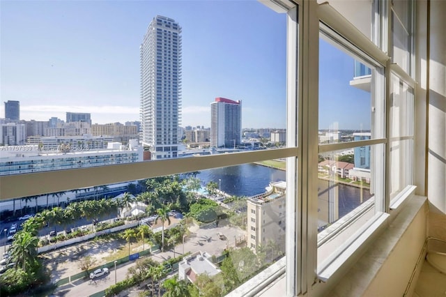 balcony featuring a view of city and a water view