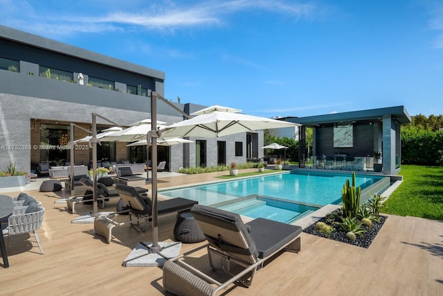 view of swimming pool with a pool with connected hot tub