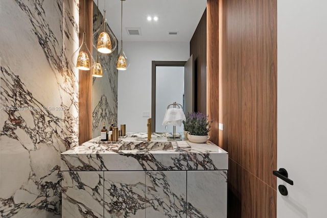 bathroom with visible vents and vanity