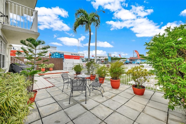 view of patio featuring a balcony