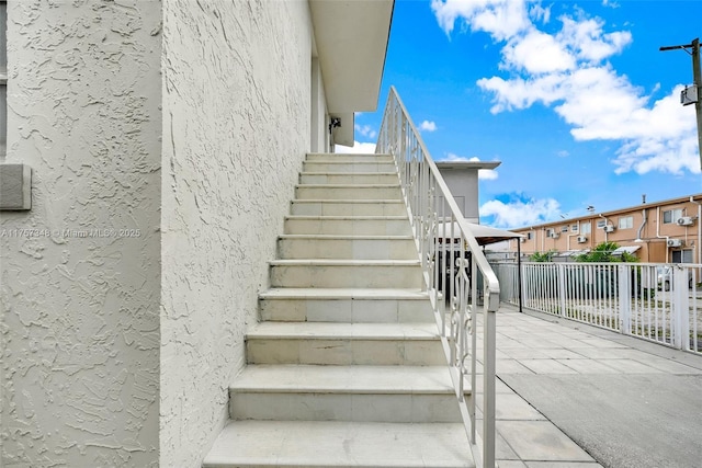 staircase featuring a residential view