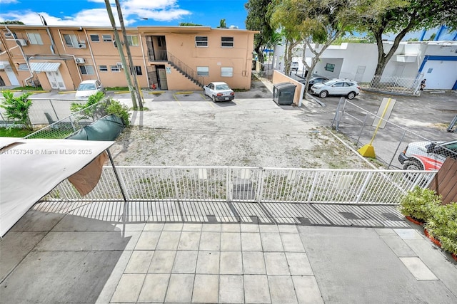 exterior space with a fenced front yard and a residential view