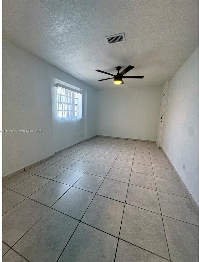 2318 Scott St, Hollywood, FL 33020 - empty room featuring ceiling fan, a textured ceiling, and light tile patterned floors