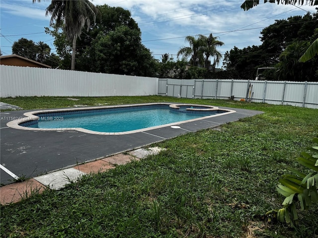 2318 Scott St, Hollywood, FL 33020 - view of swimming pool with a fenced backyard, a pool with connected hot tub, and a patio area