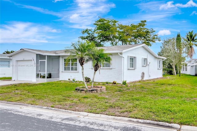 single story home with concrete driveway, stone siding, an attached garage, and a front yard