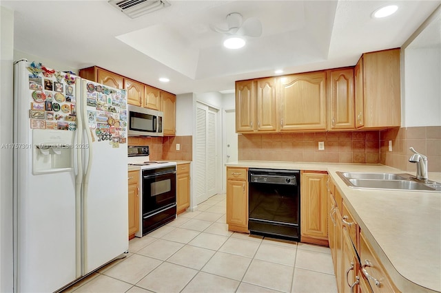 kitchen with white refrigerator with ice dispenser, range with electric stovetop, dishwasher, a tray ceiling, and stainless steel microwave