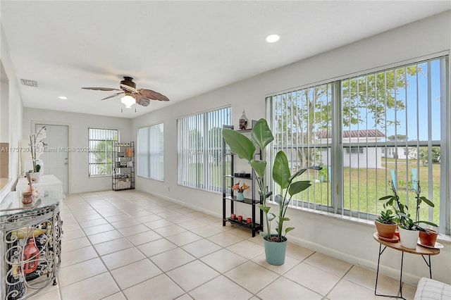 sunroom / solarium with ceiling fan and visible vents