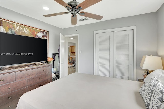 bedroom with a closet, recessed lighting, visible vents, and a ceiling fan