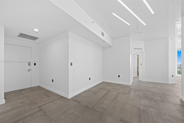 bonus room with visible vents and baseboards