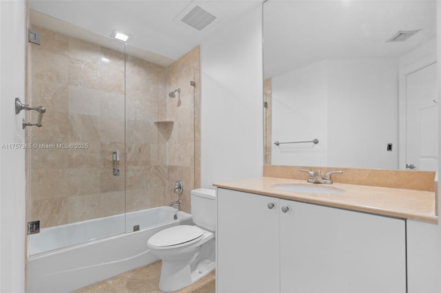 full bath with visible vents, vanity, toilet, and combined bath / shower with glass door