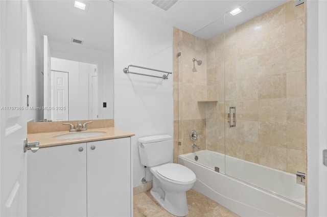 full bathroom featuring enclosed tub / shower combo, visible vents, vanity, and toilet