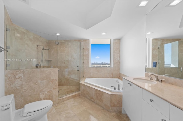 bathroom featuring a garden tub, a shower stall, toilet, and vanity