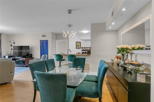 dining area featuring light wood-type flooring, visible vents, and recessed lighting