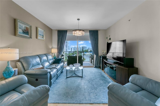 living room with a chandelier and carpet flooring