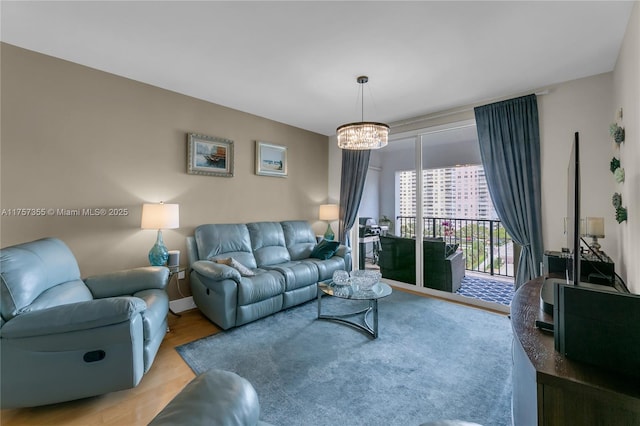 living area featuring an inviting chandelier