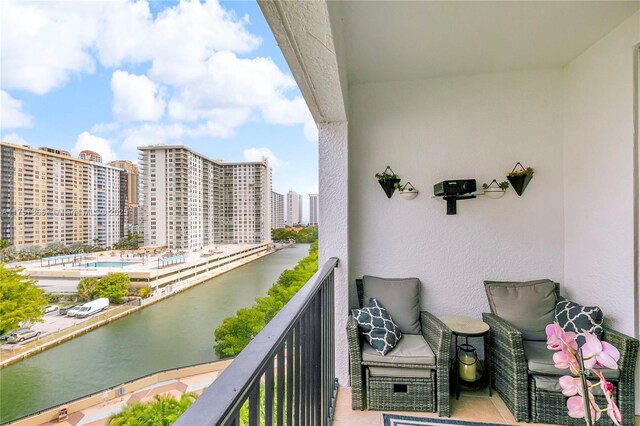 balcony with a city view and grilling area