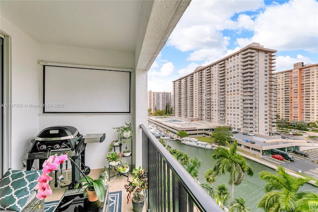 balcony with a view of city and a water view