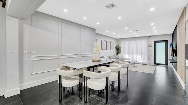 603 N 32nd Ave, Hollywood, FL 33021 - dining room with baseboards, visible vents, a decorative wall, and recessed lighting