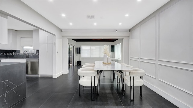 603 N 32nd Ave, Hollywood, FL 33021 - dining room featuring recessed lighting, visible vents, a decorative wall, and dark tile patterned floors