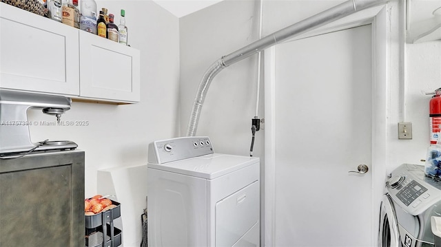 603 N 32nd Ave, Hollywood, FL 33021 - washroom with cabinet space and separate washer and dryer