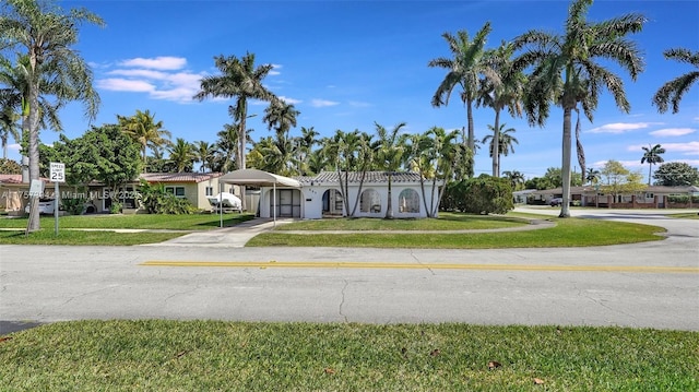 603 N 32nd Ave, Hollywood, FL 33021 - mediterranean / spanish home with a carport, a front lawn, and concrete driveway