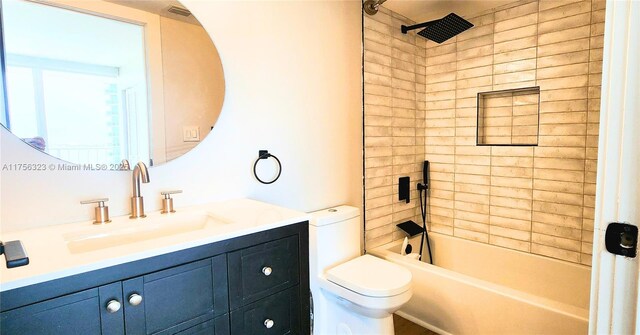 bathroom with toilet, visible vents,  shower combination, and vanity