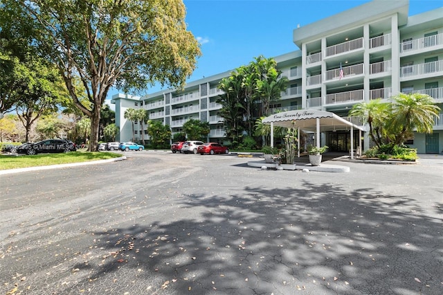 view of property with uncovered parking