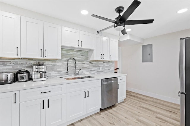 802 Cypress Grove Ln Unit 409, Pompano Beach, FL 33069 - kitchen featuring a sink, stainless steel appliances, ceiling fan, electric panel, and baseboards