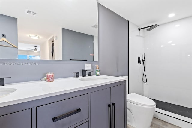 full bath with double vanity, visible vents, toilet, a sink, and walk in shower