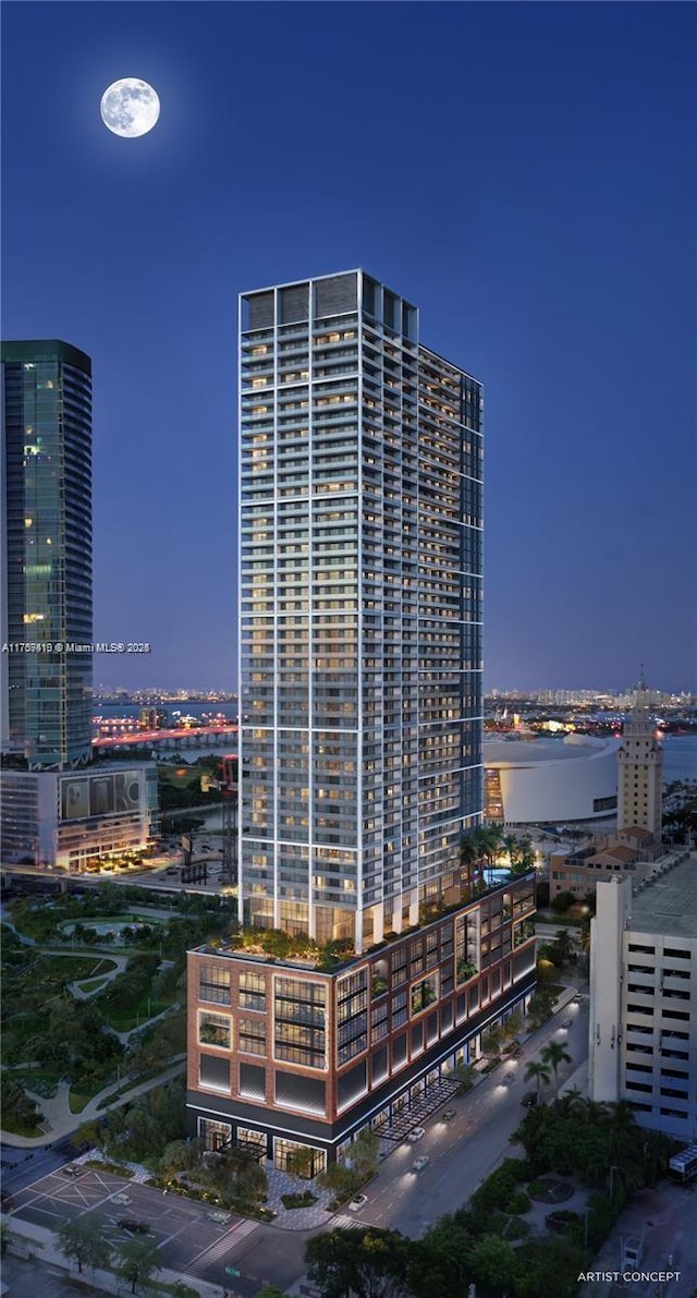 view of building exterior with a view of city lights