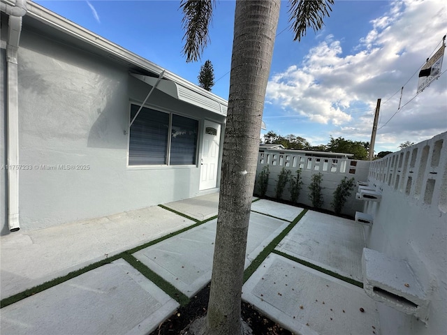 view of patio with fence