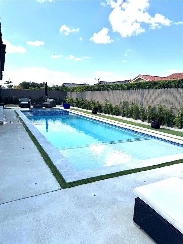 view of pool with a patio area, a fenced backyard, and a fenced in pool