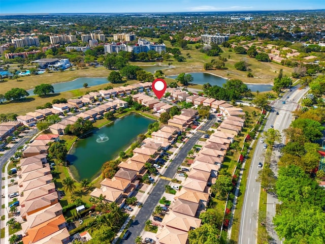 drone / aerial view with a water view and a residential view