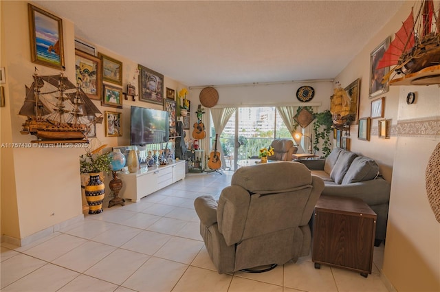 living room featuring light tile patterned floors and a textured ceiling