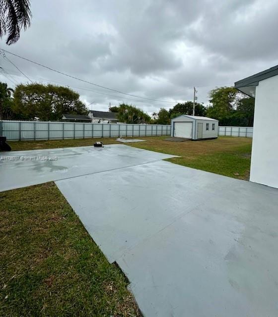 view of patio / terrace featuring a fenced backyard and an outdoor structure