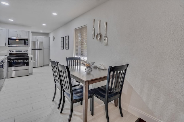 6444 Mcclellan St, Hollywood, FL 33024 - dining room with baseboards and recessed lighting