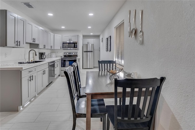 6444 Mcclellan St, Hollywood, FL 33024 - dining space featuring a textured wall, visible vents, and recessed lighting