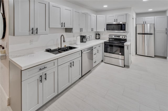 6444 Mcclellan St, Hollywood, FL 33024 - kitchen featuring a sink, stainless steel appliances, light countertops, and recessed lighting